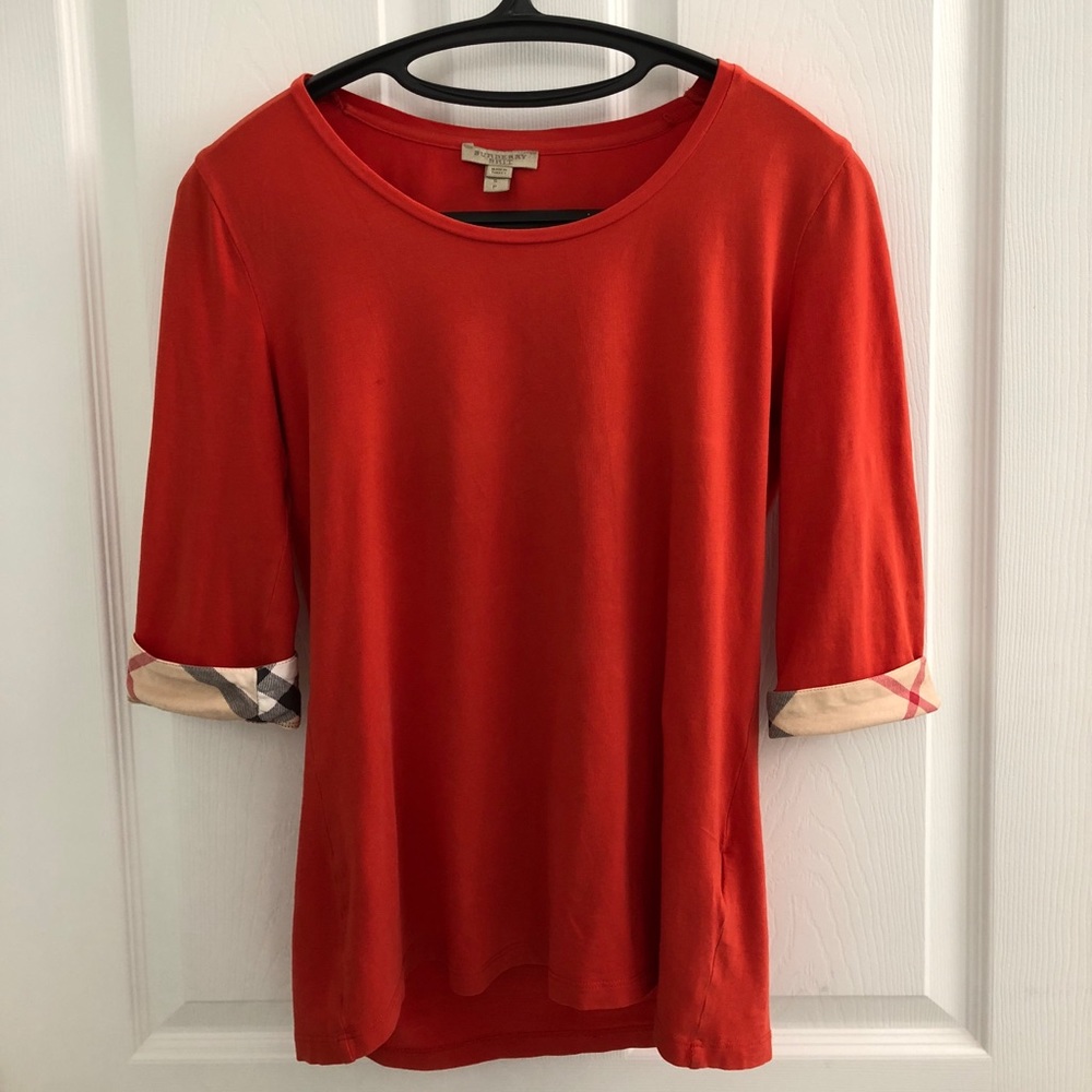 Burberry red shirt.